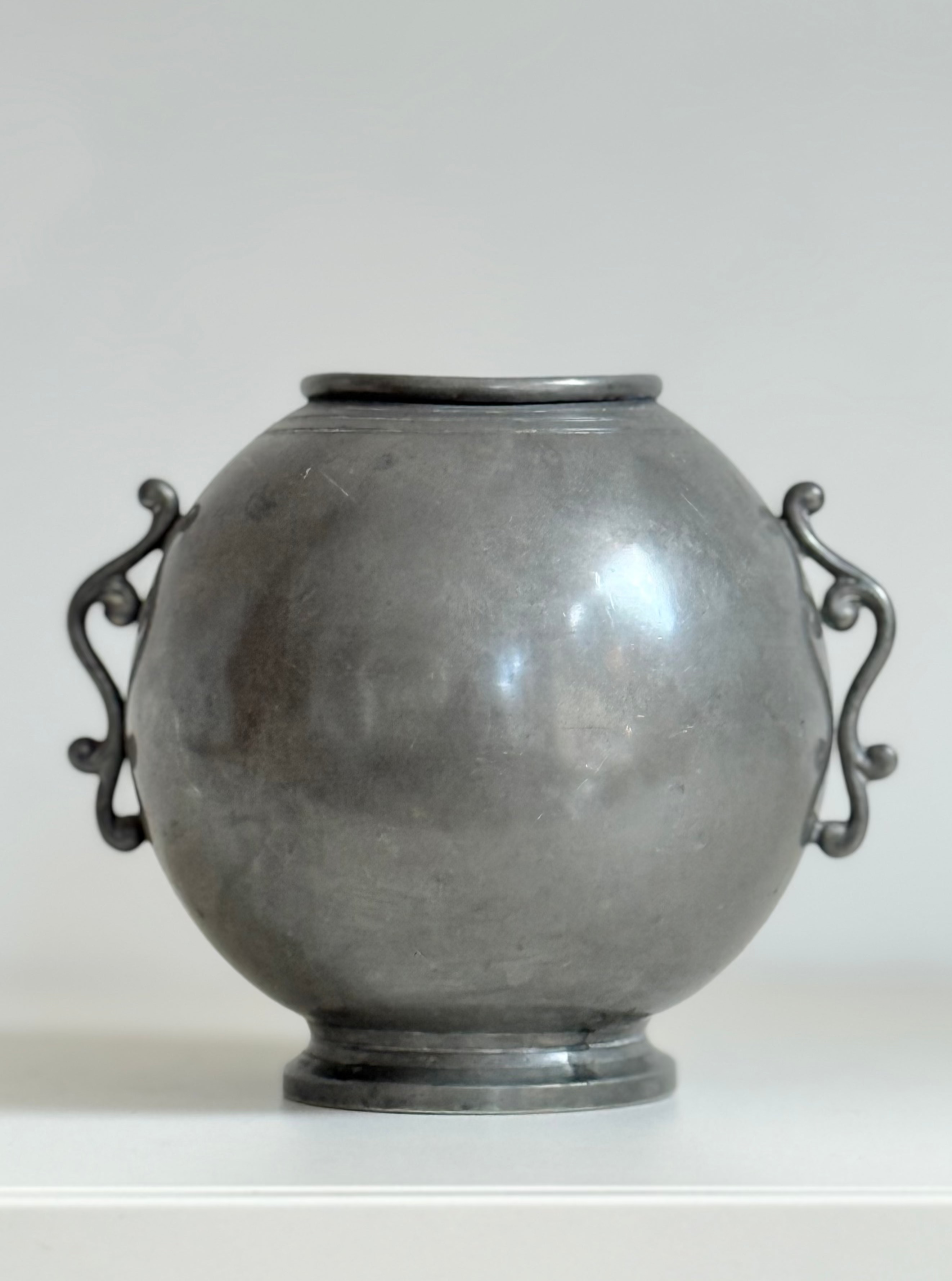 vase with wings in pewter