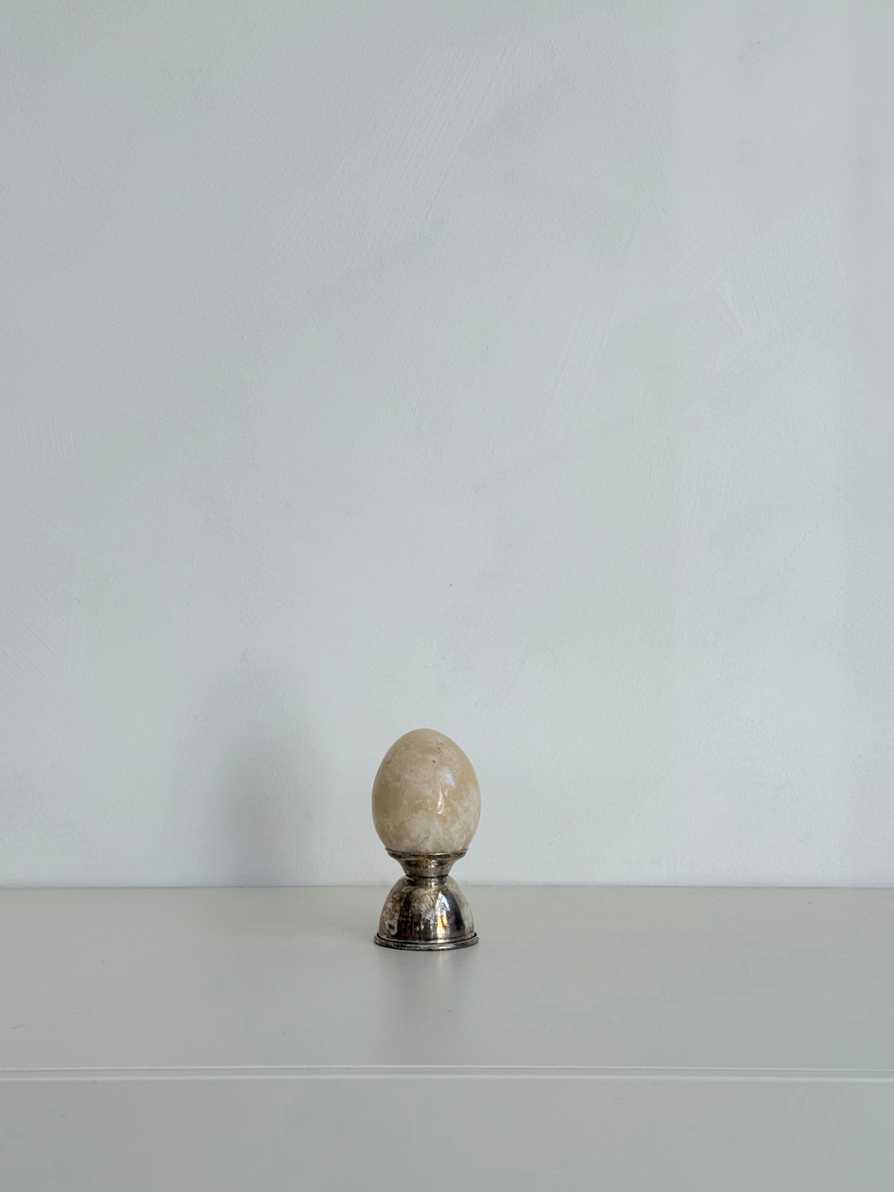 marble egg and silver holder