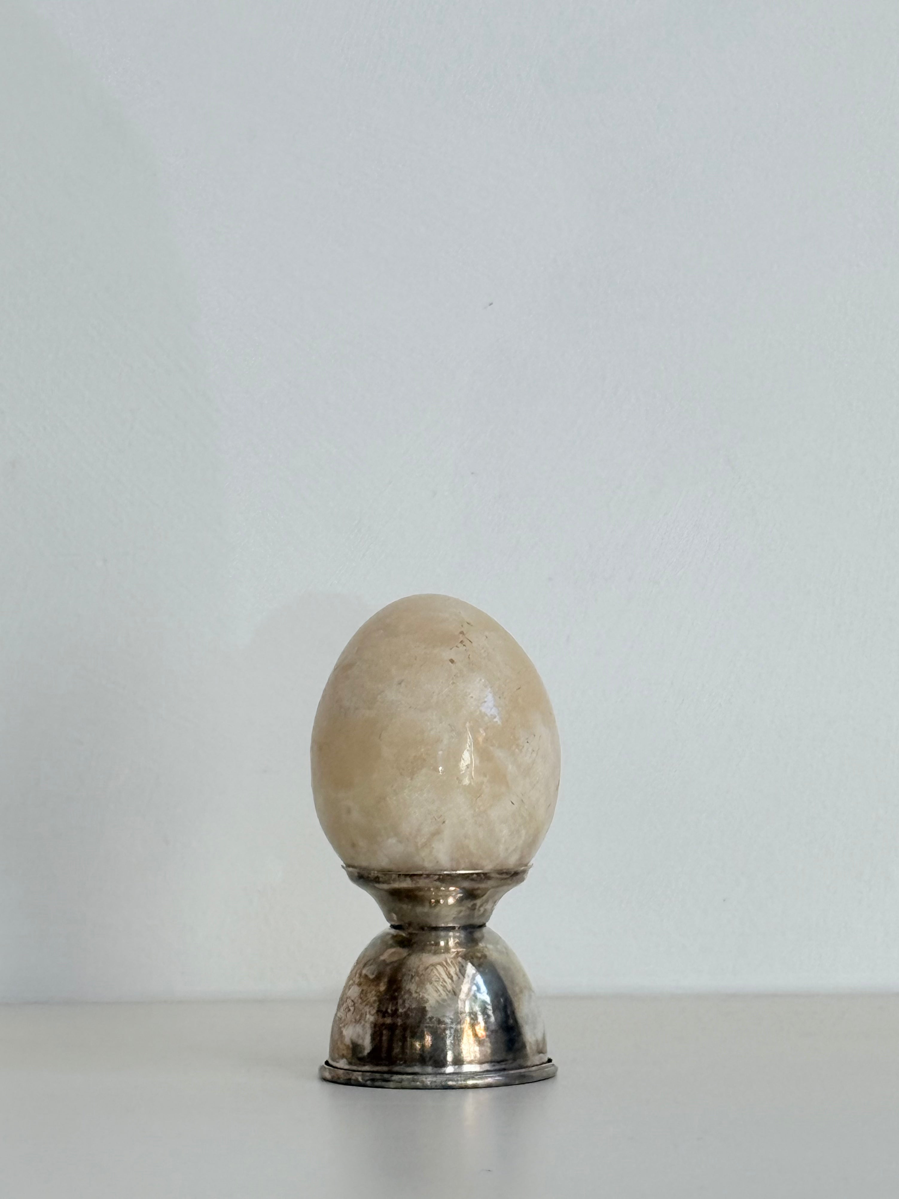 marble egg and silver holder