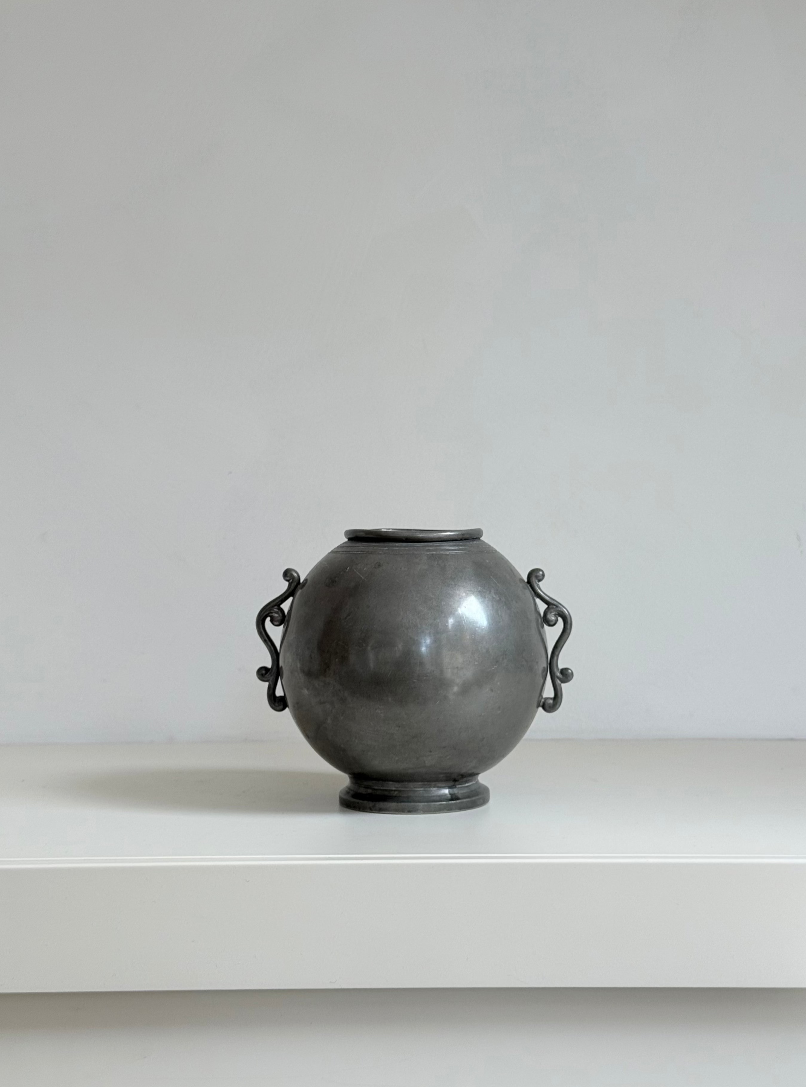 vase with wings in pewter