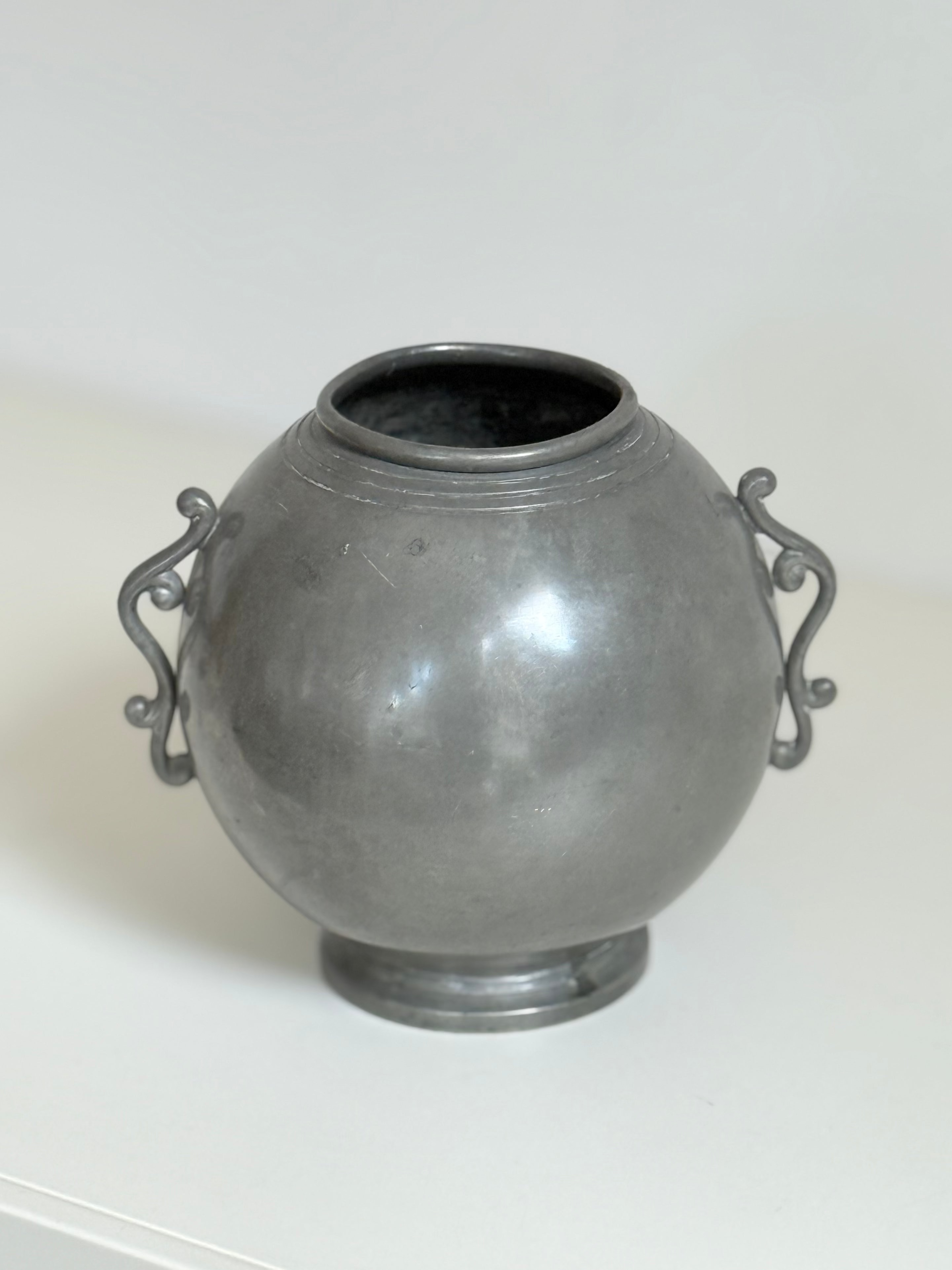 vase with wings in pewter