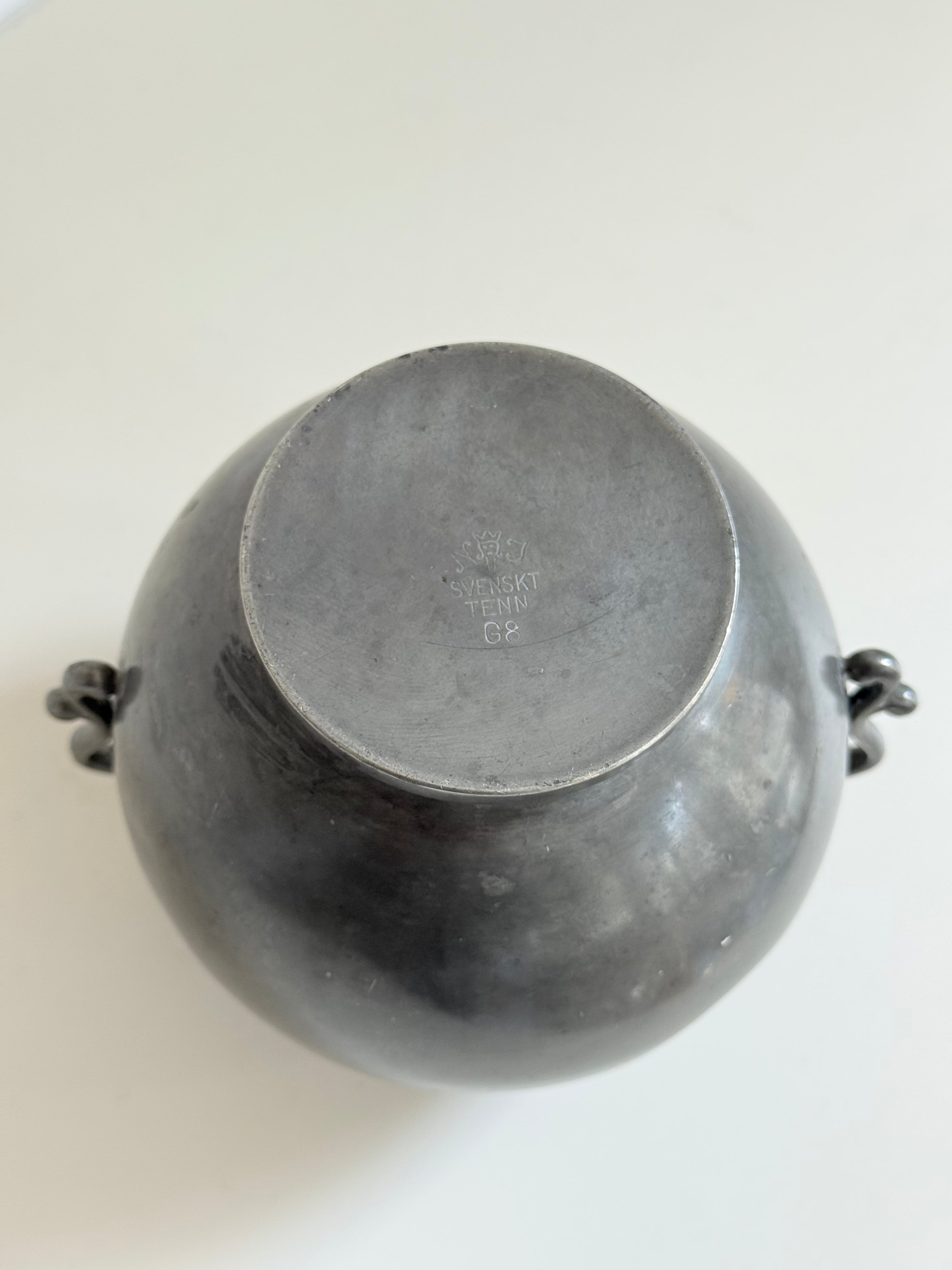 vase with wings in pewter