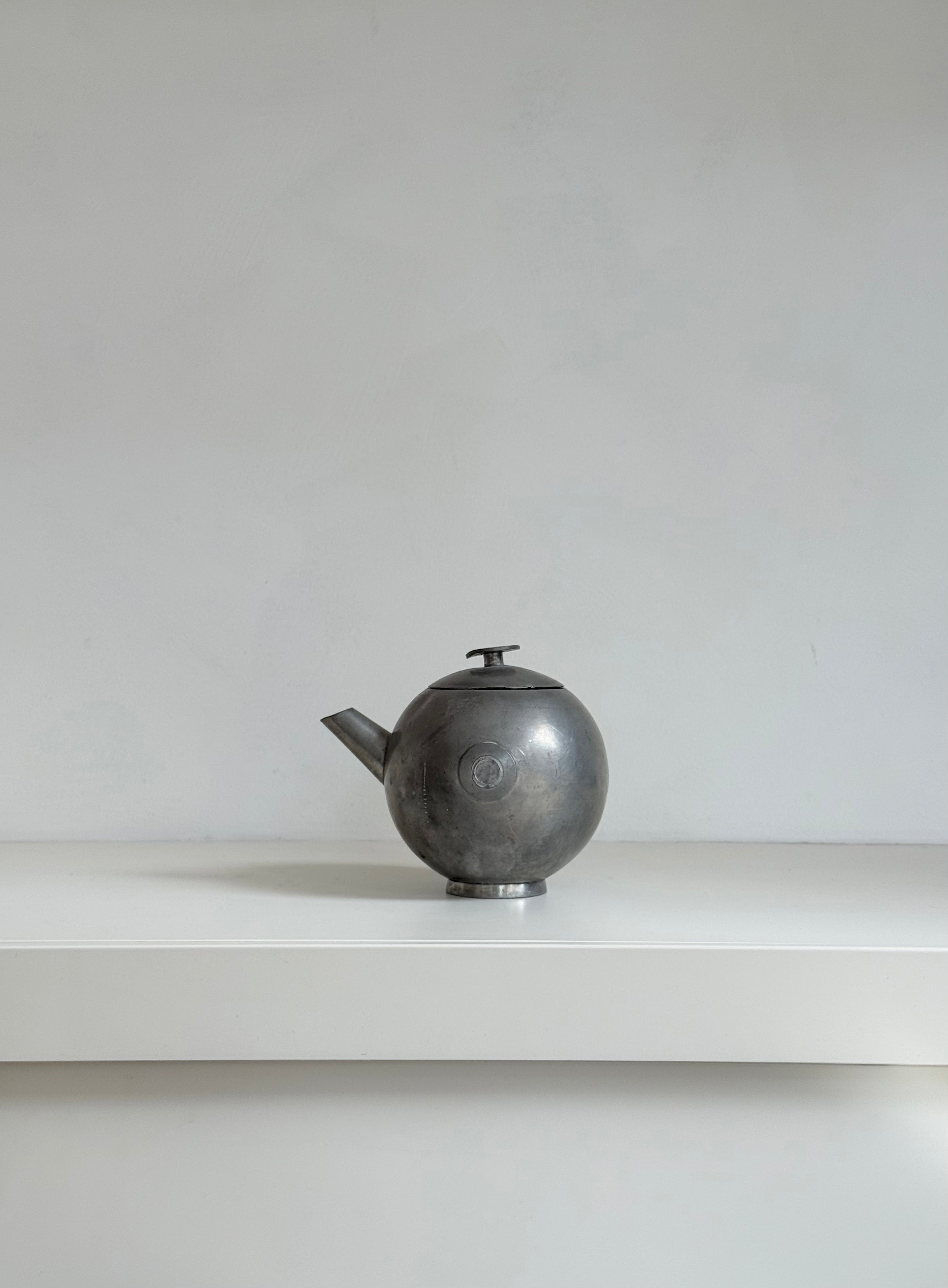 pewter teapot with lid in tin, marked svenskt tenn, 1933