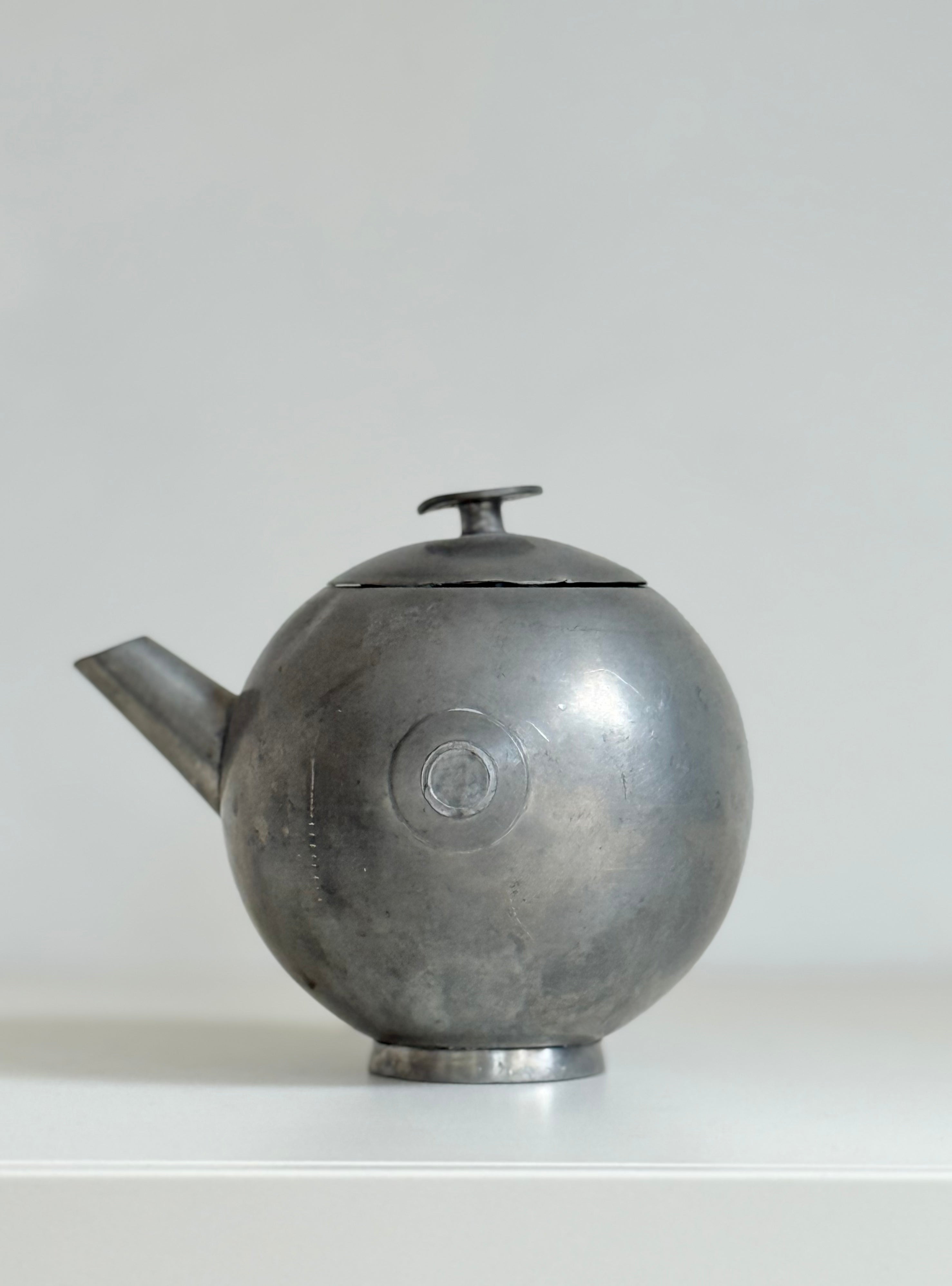 pewter teapot with lid in tin, marked svenskt tenn, 1933
