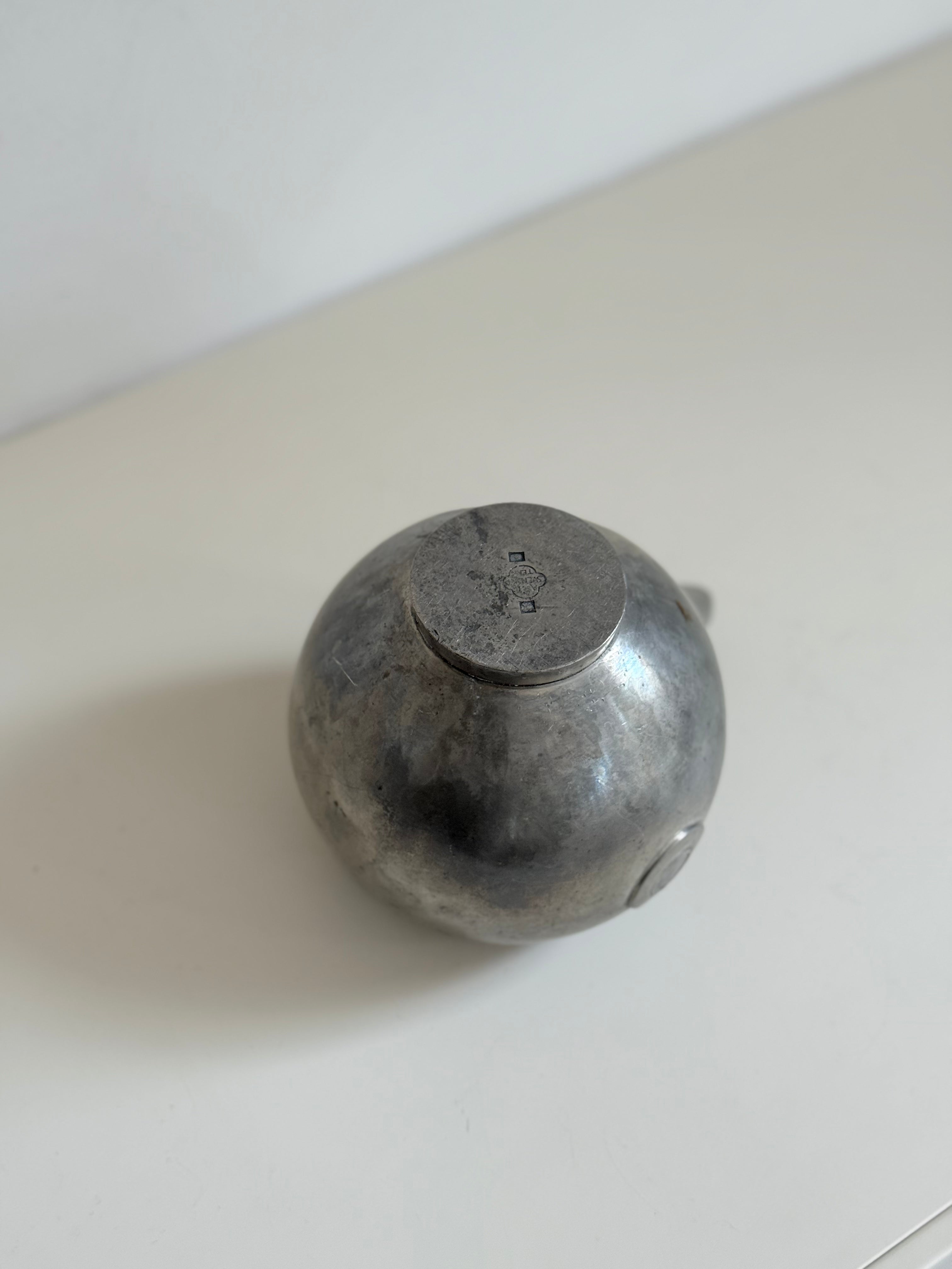 pewter teapot with lid in tin, marked svenskt tenn, 1933