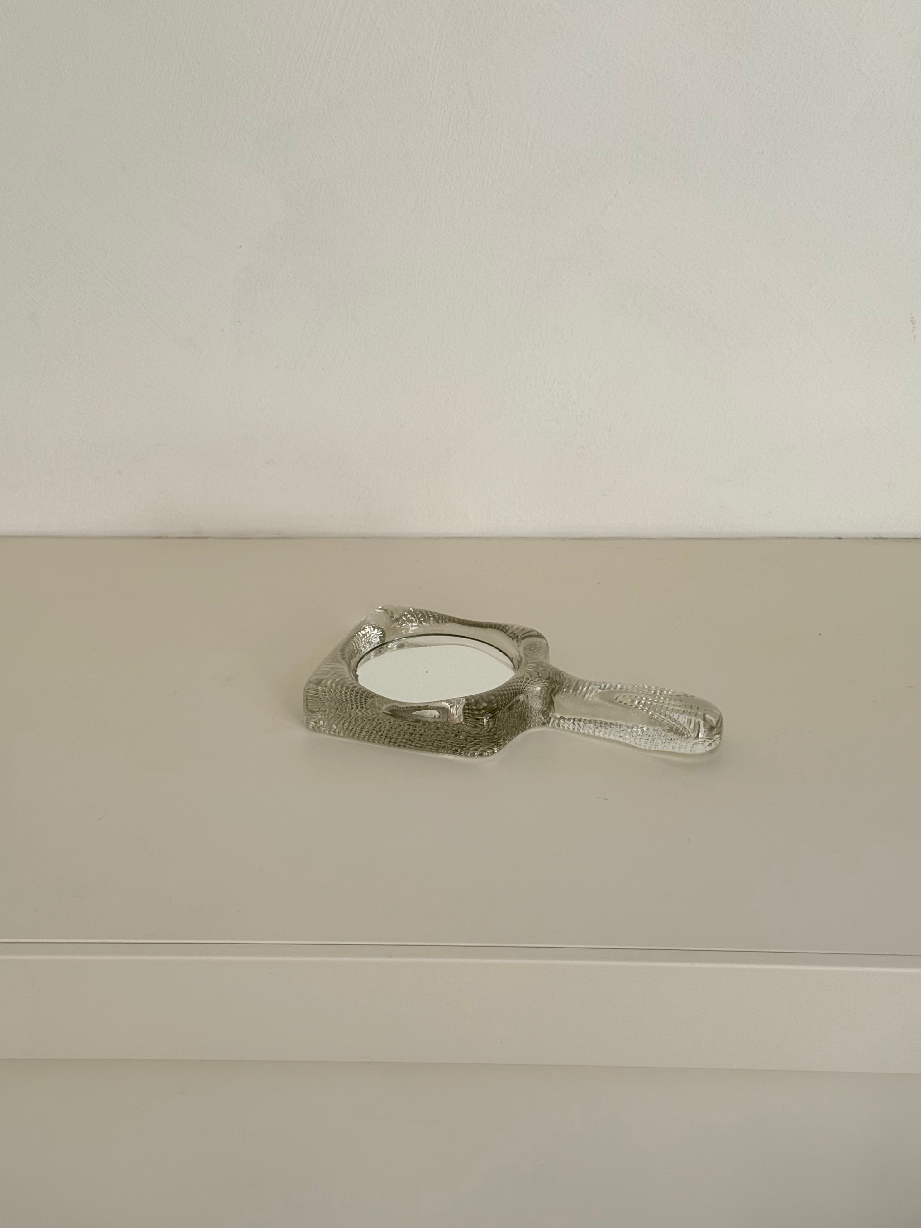 hand mirror in glass
