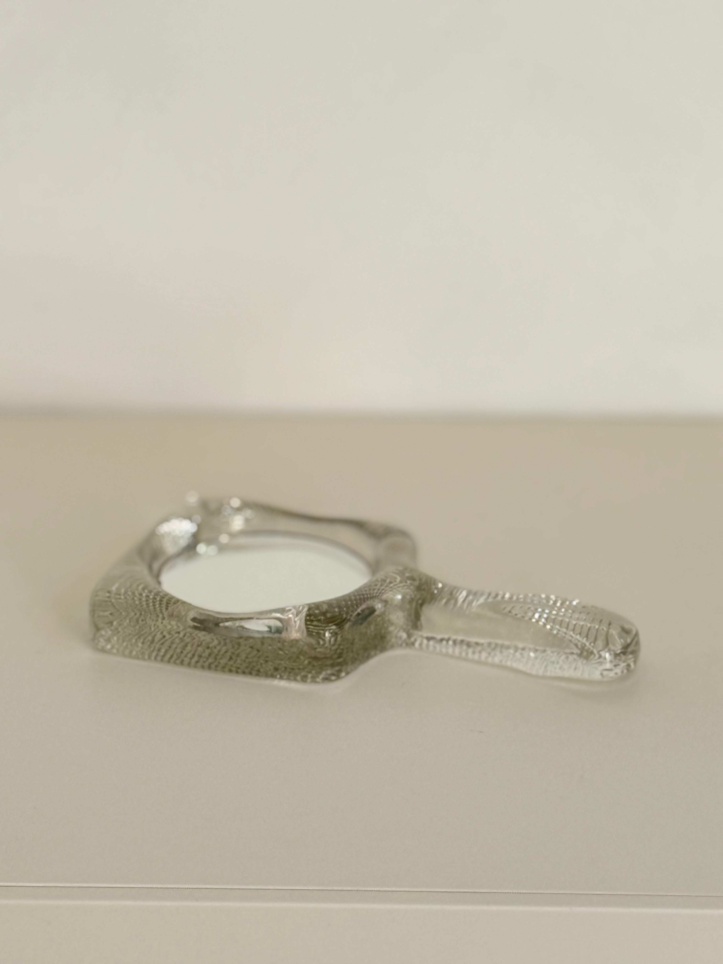 hand mirror in glass