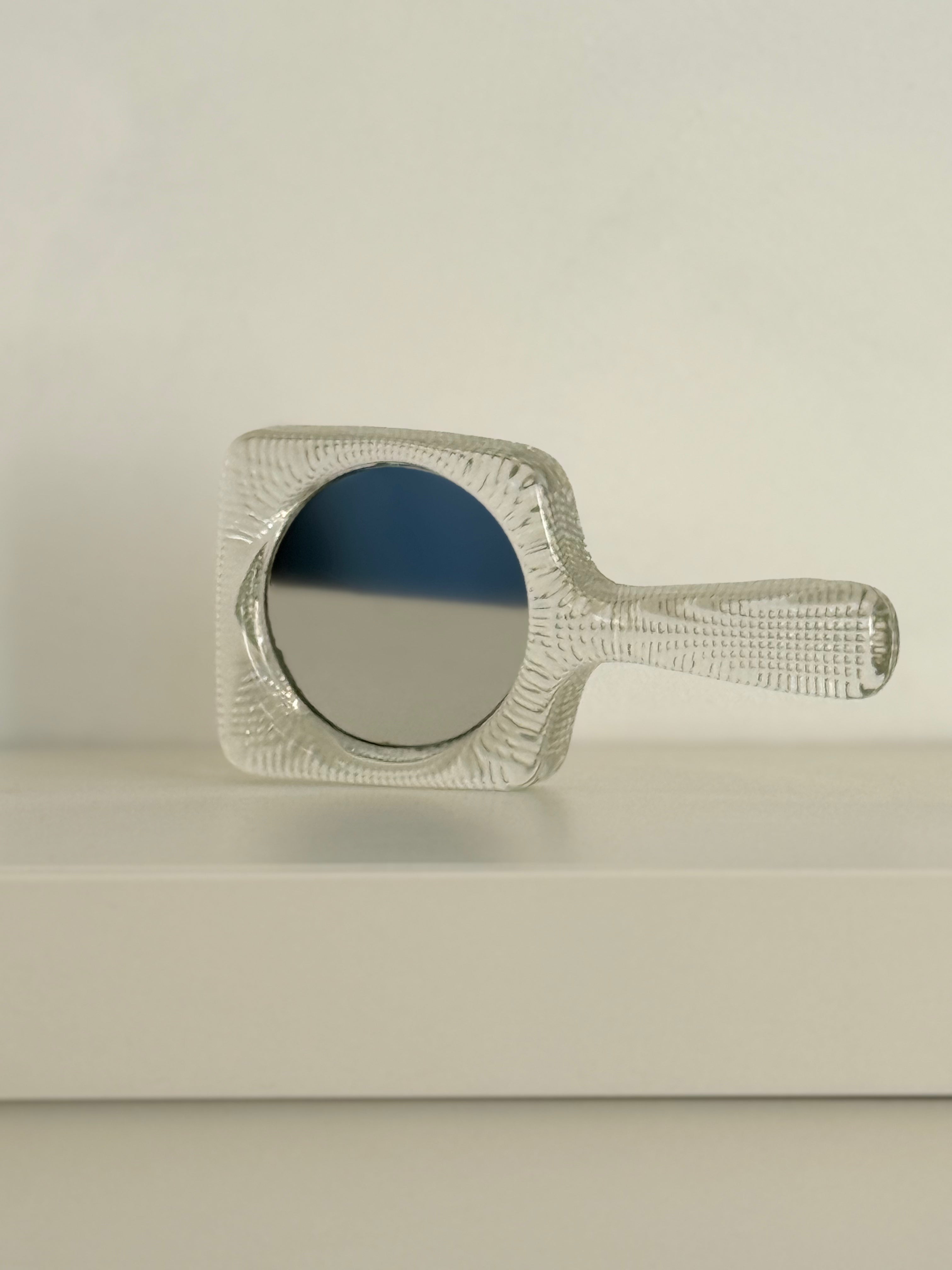 hand mirror in glass