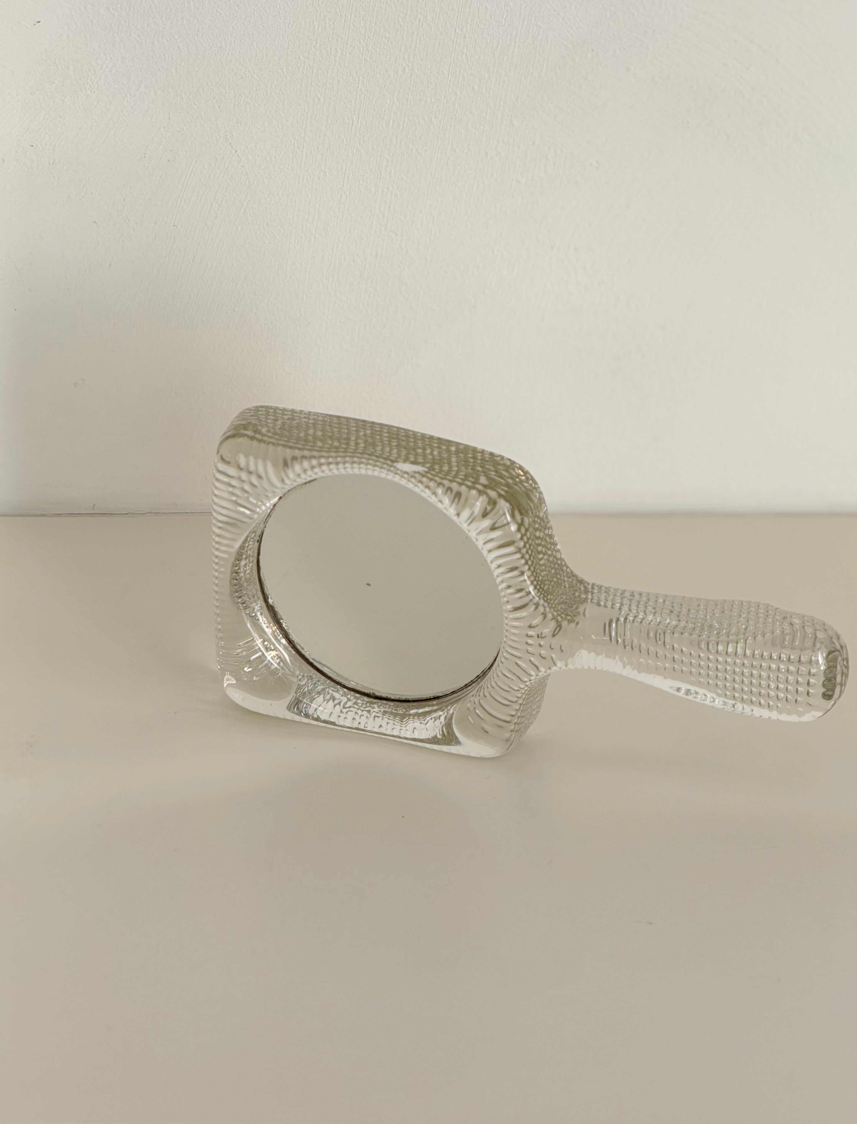 hand mirror in glass