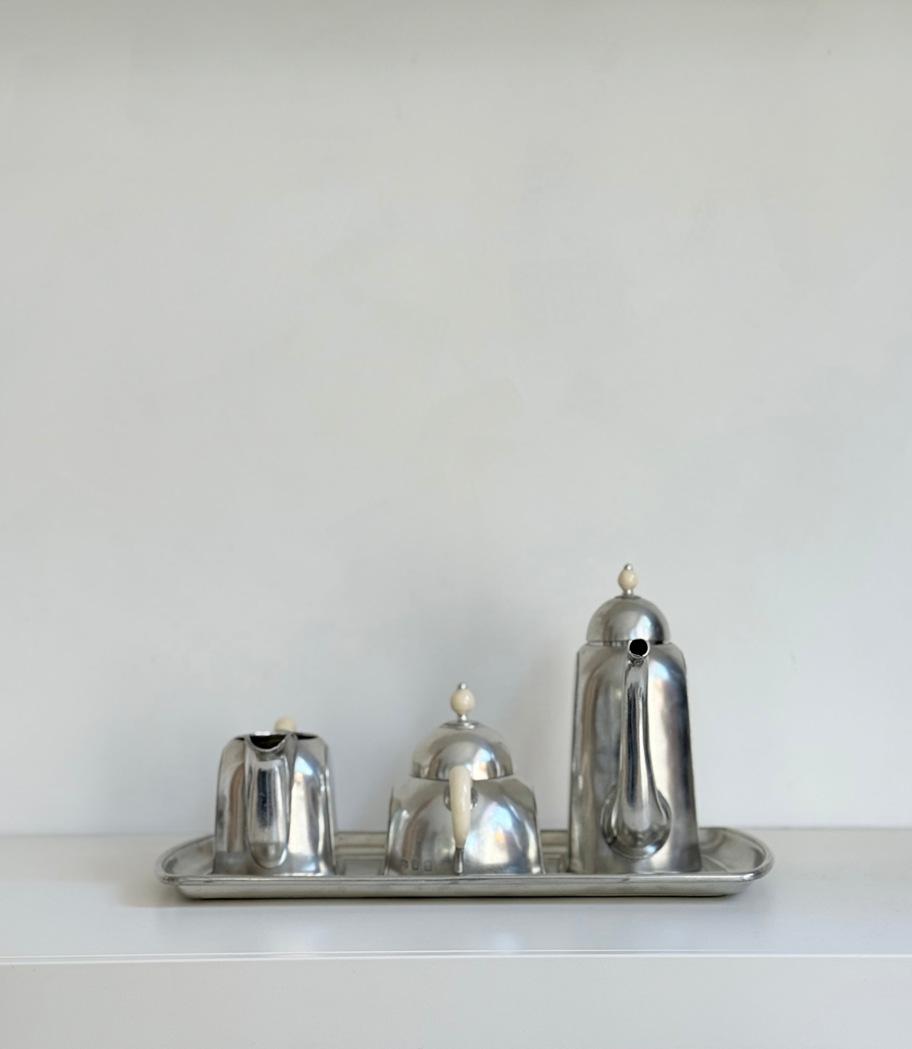 trio on tray in pewter: pitcher, sugar bowl, milk can