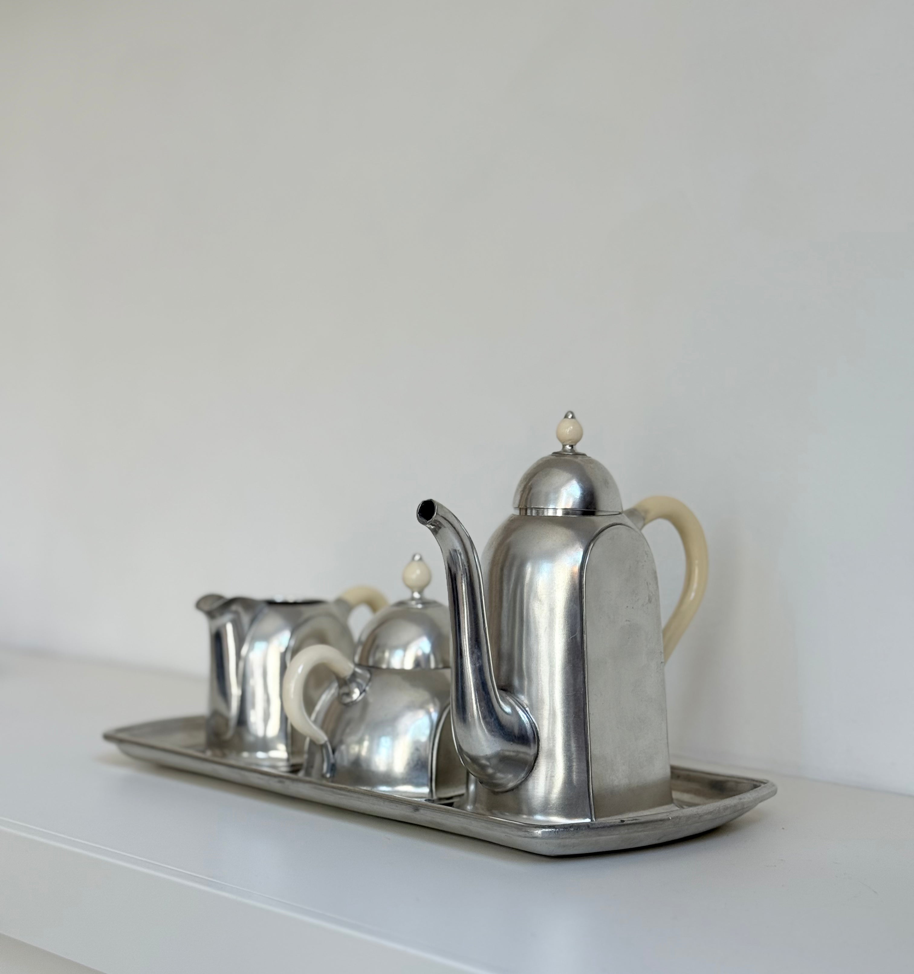 trio on tray in pewter: pitcher, sugar bowl, milk can