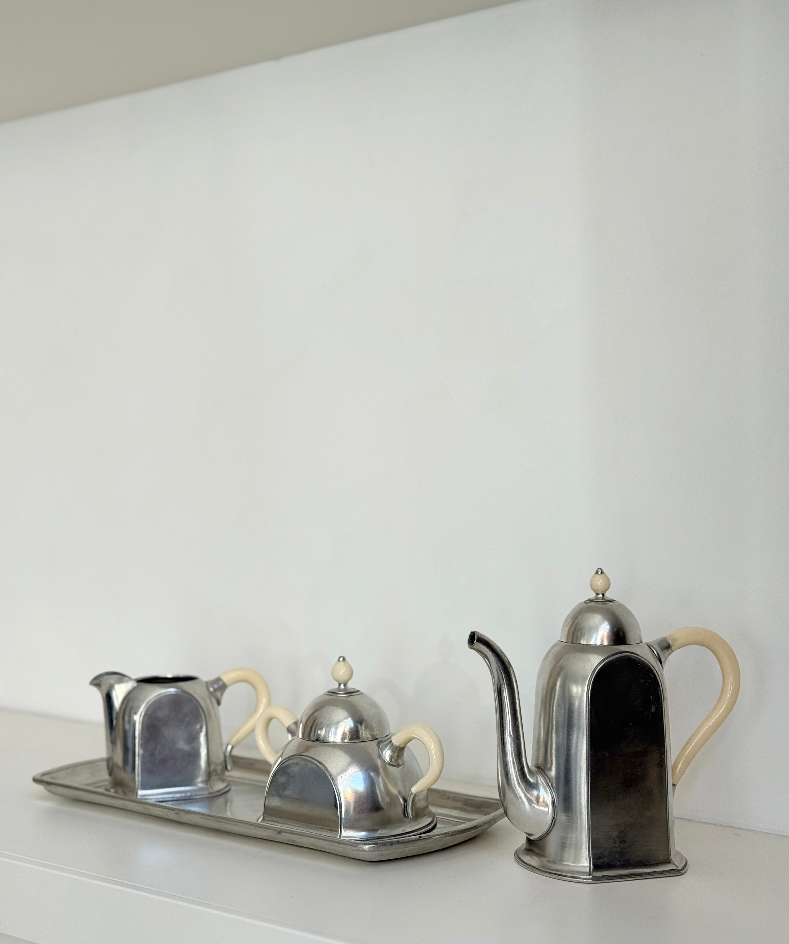 trio on tray in pewter: pitcher, sugar bowl, milk can