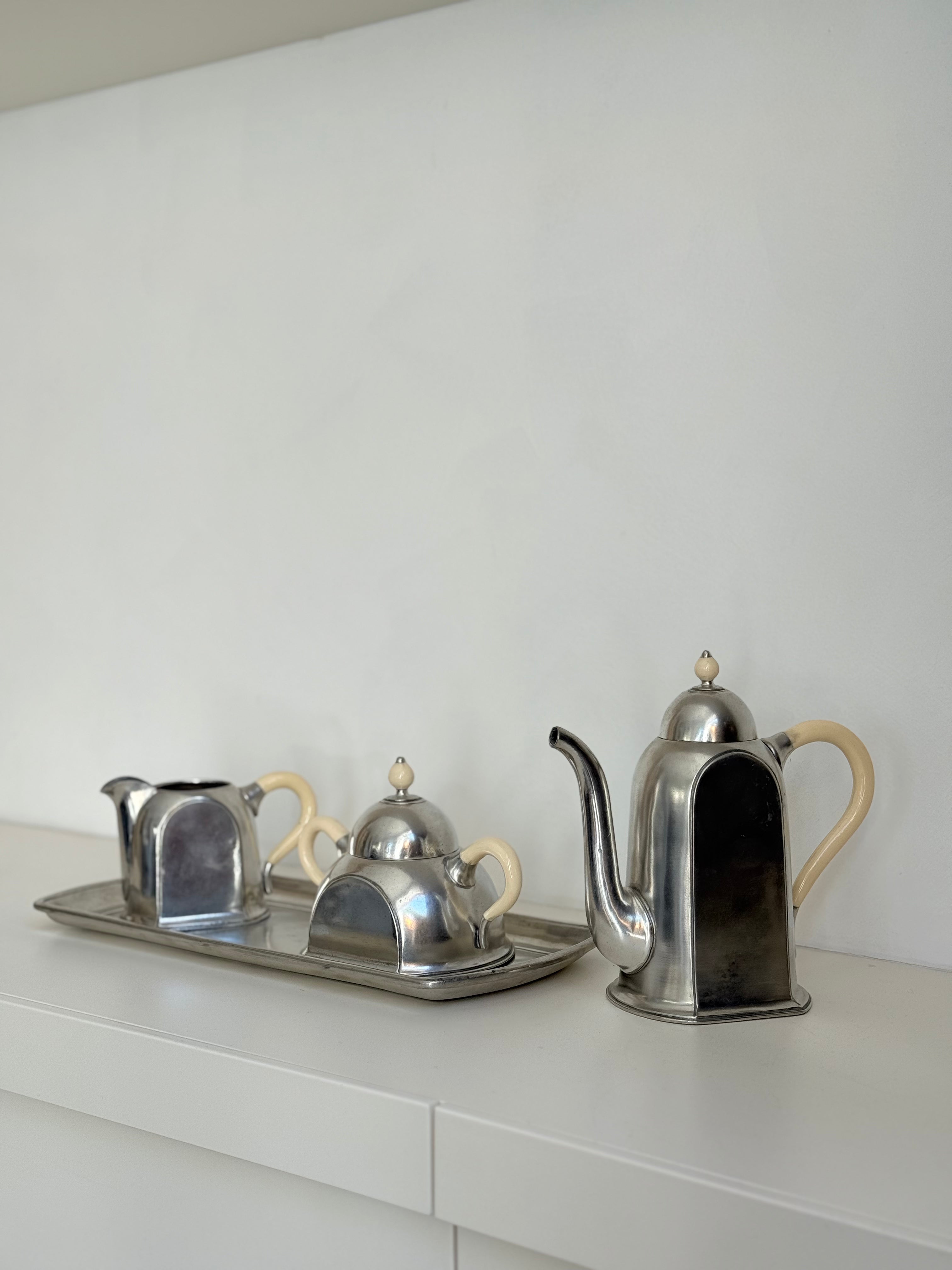 trio on tray in pewter: pitcher, sugar bowl, milk can