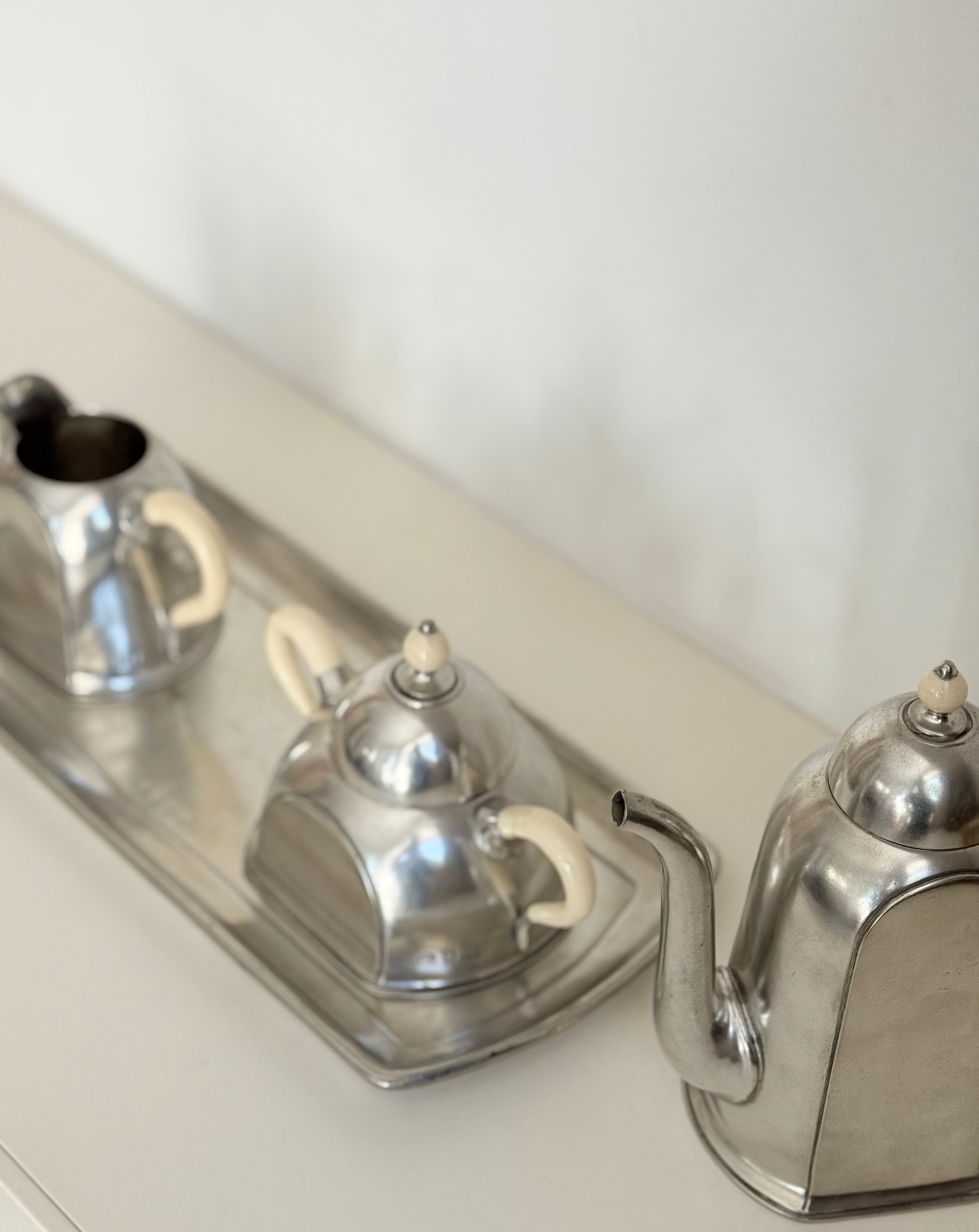 trio on tray in pewter: pitcher, sugar bowl, milk can