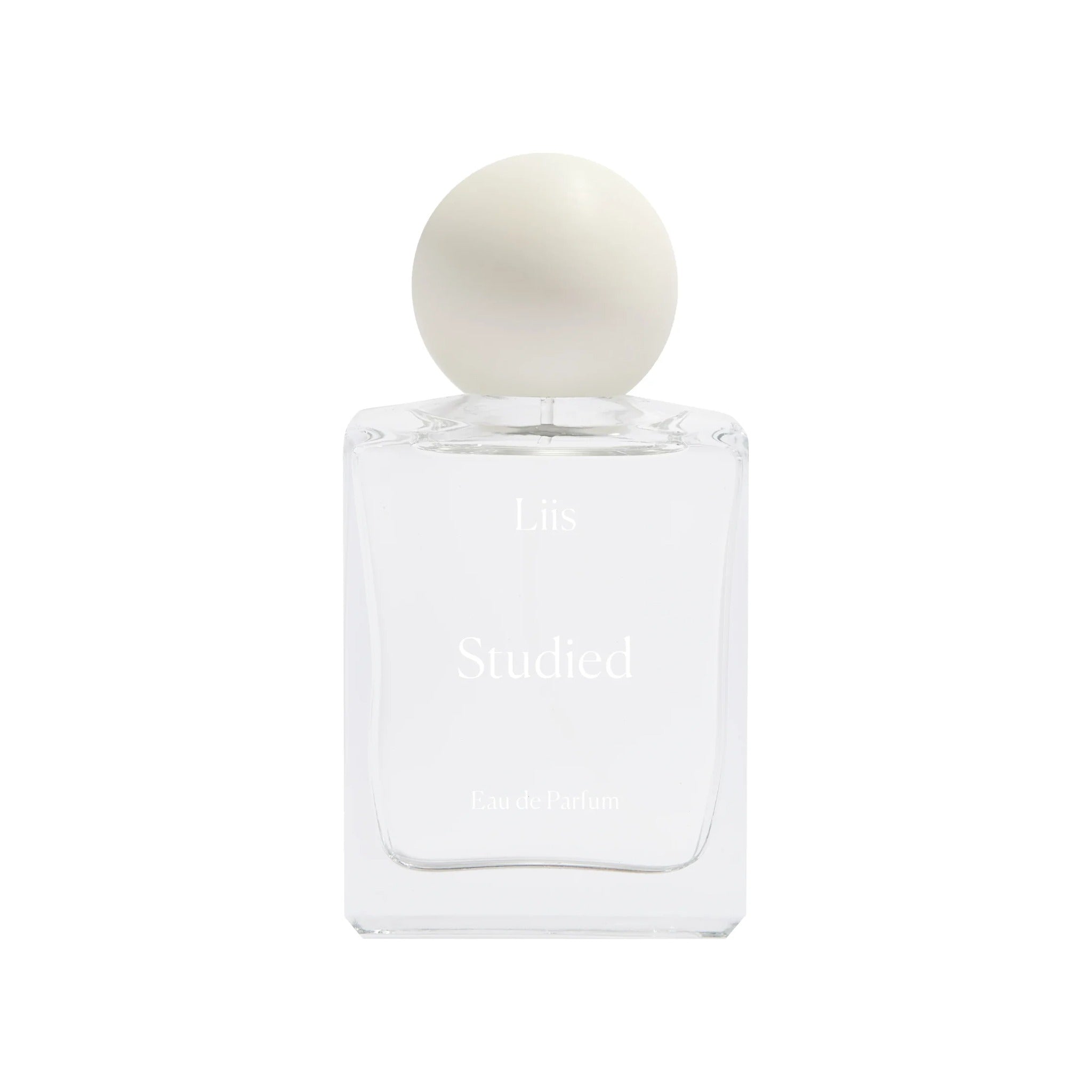 Liis Studied Eau de Parfum in a clear glass bottle with a round matte white spherical cap