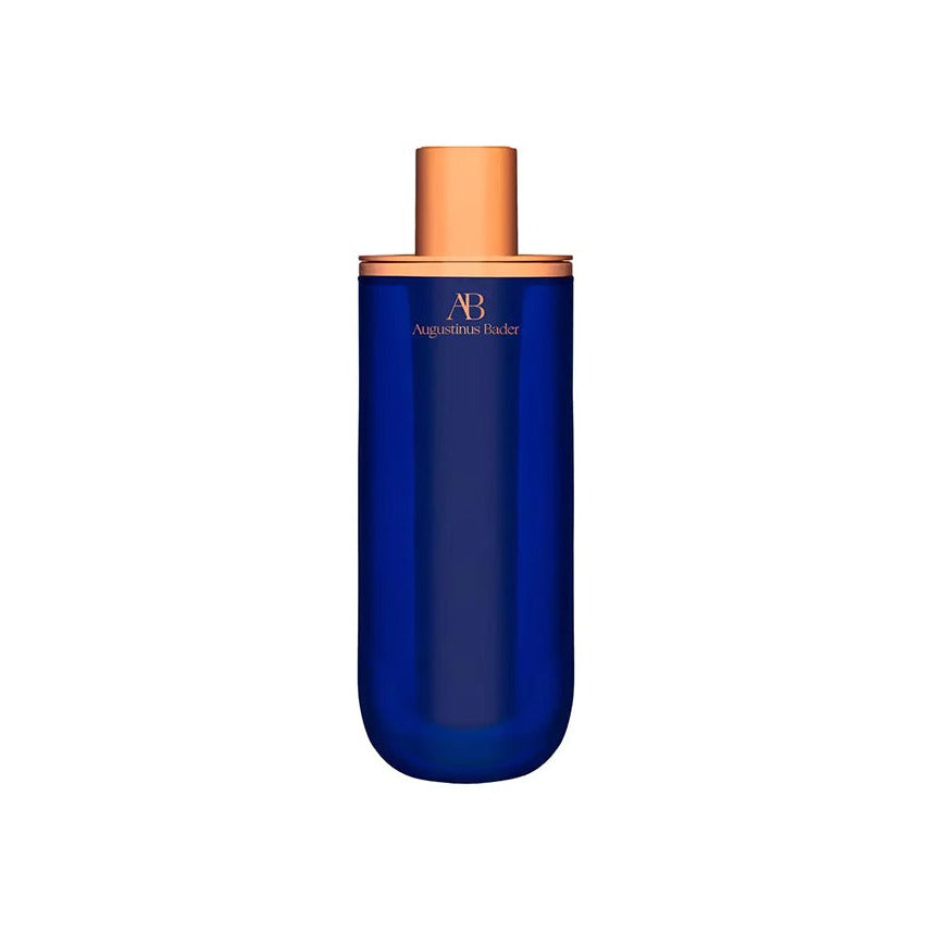 Augustinus Bader The Serum in a cobalt blue bottle with a rose gold cap
