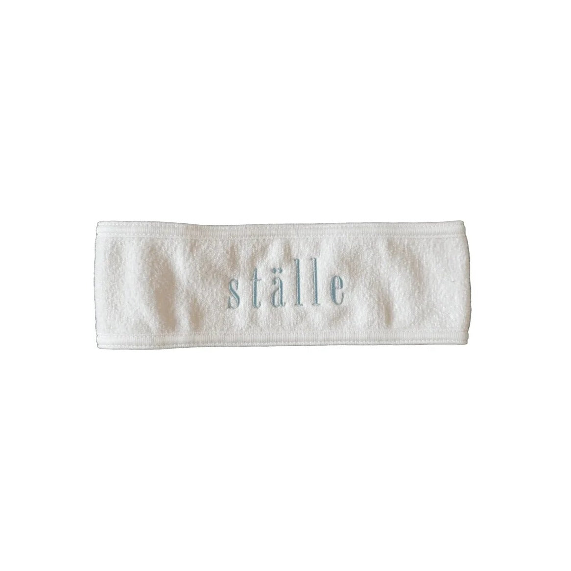 ställe studios logo headband in muesli with light blue embroidered lettering