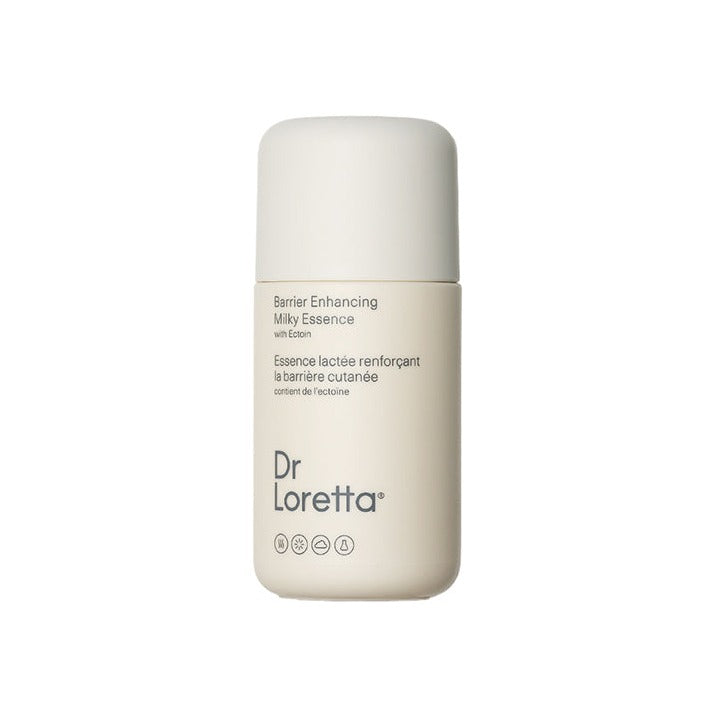 Dr Loretta Barrier Enhancing Milky Essence in a compact cream-toned bottle with rounded cap