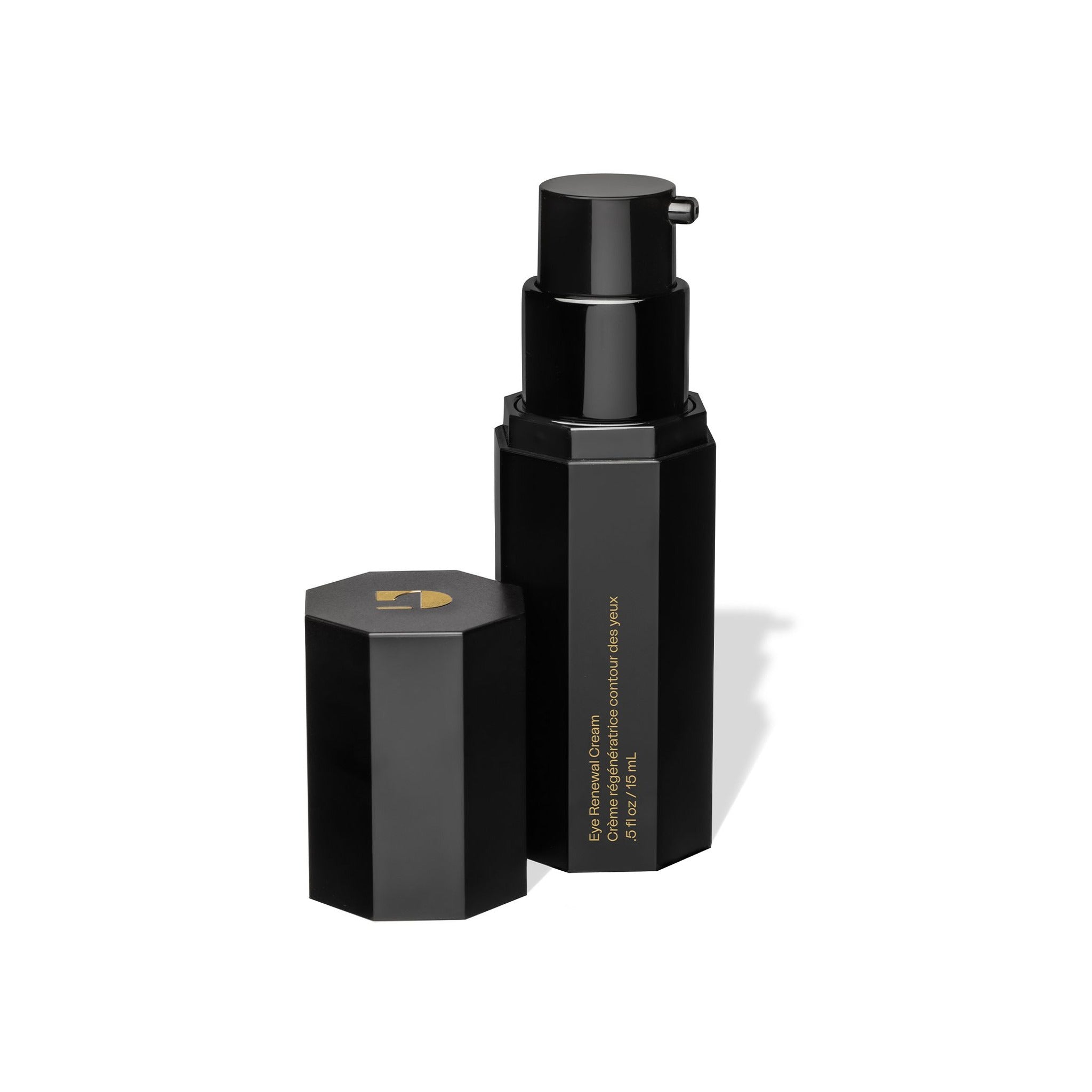 Eighth Day Eye Renewal Cream in a sleek black hexagonal pump bottle with cap placed beside it