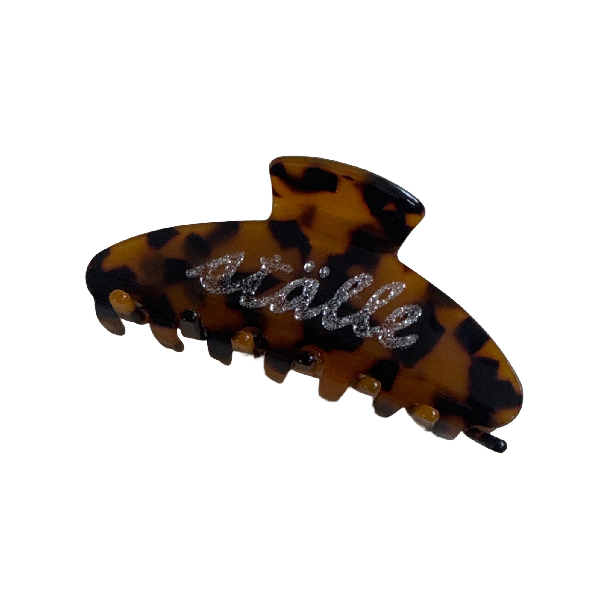 ställe studios tortoiseshell logo claw hair clip with glitter script lettering