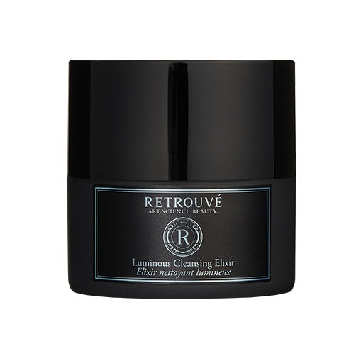 Retrouvé Luminous Cleansing Elixir in a sleek black glass jar with teal label detail