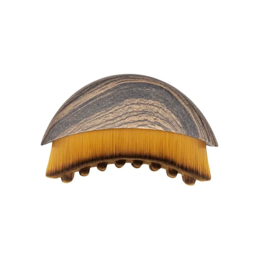 The Lymphatic Brush Body with wood-grain handle, golden bristles, and massage nodules for dry brushing