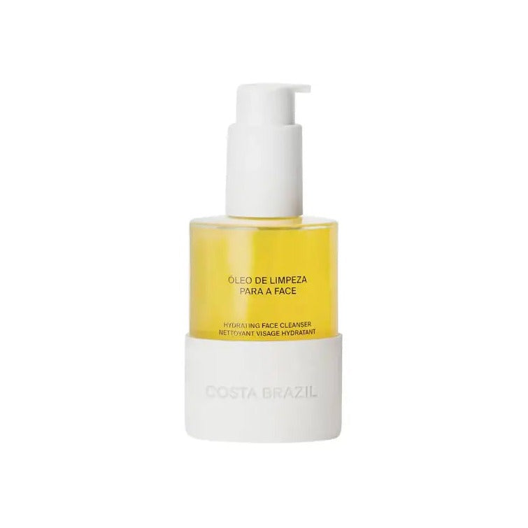 Costa Brazil Hydrating Facial Cleanser in a white pump bottle with golden oil formula visible